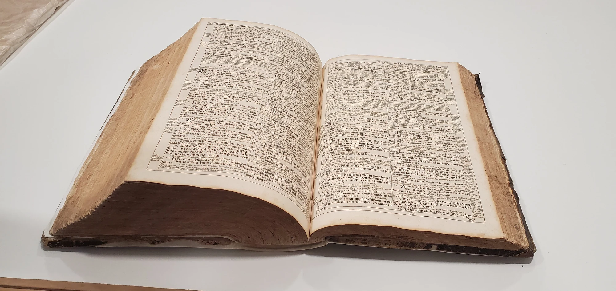 Historic book opened on a conservation table